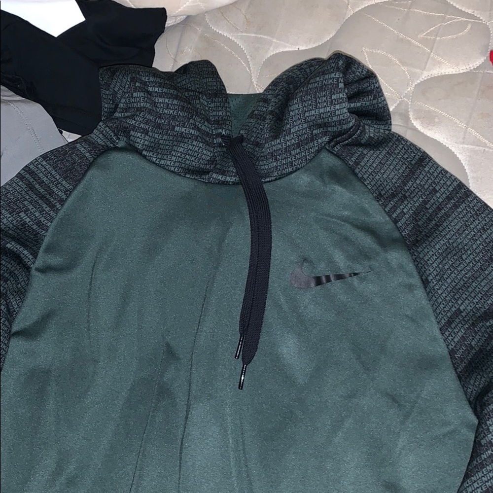 Nike hoodie with “nike” along the sleeves.